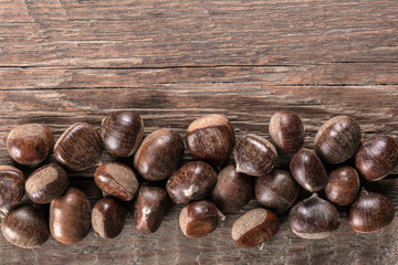 Chestnut on wooden background
