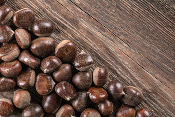 Chestnut on wooden background