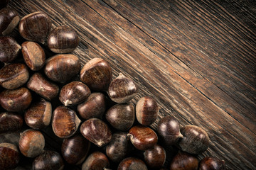 Chestnut on wooden background