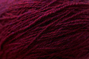 Vinous knitting thread texture, handiwork backdrop. Bright handiwork background, crochet woolen string, Leisure, hobby, needlework concept
