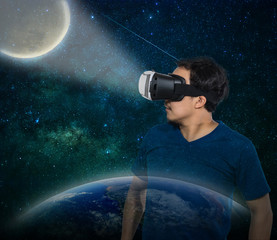 Double exposure of Asian man wearing virtual reality over milky