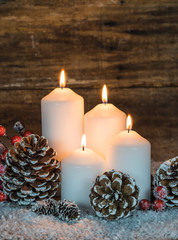 Advent background with burning candles and christmas decoration