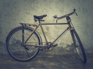 Vintage and classic bicycle over the brick wall background, vint