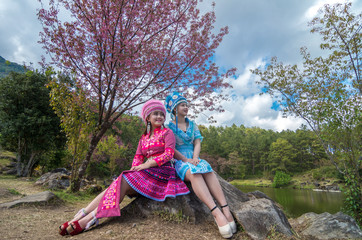 Portrait of Two Hmong girls with traditional Hmong suit on the S