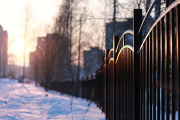 winter landscape iron fence at sunset