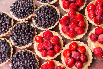 Tartlets with different kinds of berries.