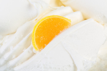 Vanilla ice-cream with fruit on the top.