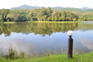 Garden lamp in a nation park with lake and forest background,chet khot - pong kon sao nature study...