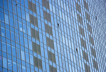 Fototapeta na wymiar wall glass skyscraper with reflection of the sky at night.