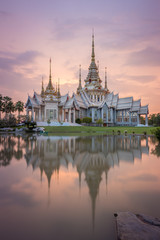 Wat Luang Pho Toh temple with water reflection in twilight time,