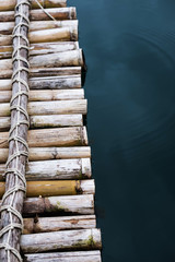 Close-up bamboo raft on the water