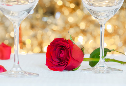 Red rose on a table. Romantic dinning and date night concept. 