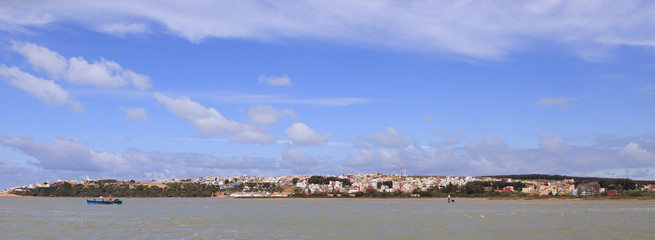 The small fishing port of Merja Zerga across the blue lagoon, Morocco.