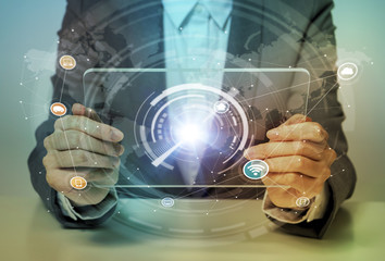 woman looks transparent monitor panel that indicates technological graphics