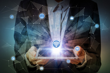 woman holding tablet device and internet of things concept