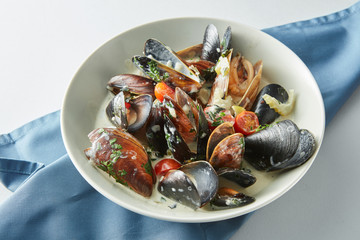 Serving of fresh cooked blue mussels in plate