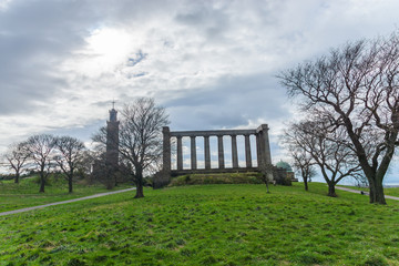 The unfinished National Monument, built to commemorate the soldiers of the Napoleonic Wars and Nelson Monument on Calton Hill, Edinburgh, Scotland, UK.