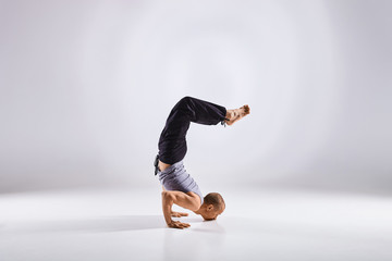 Man doing yoga isolated on white background