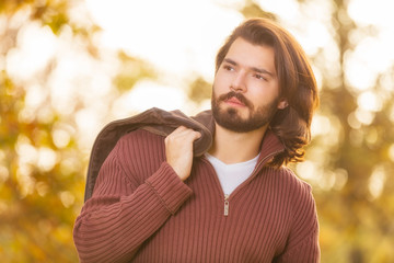 Young man posing in the park.