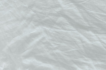 Unmade bed sheet texture