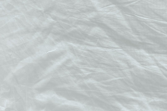 Unmade bed sheet texture
