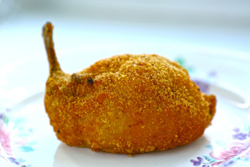 kiev chicken cutlet on bone close up photo