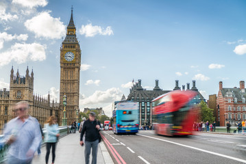Fototapeta na wymiar Tourists along Westminster Bridge in London. Blurred long exposu