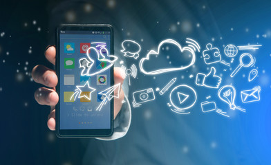 Hand of a man holding smartphone with internet icons all around