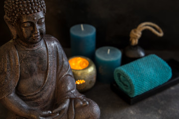 buddah witn candle and towel spa concept