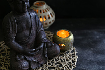 Fototapeta premium buddah witn candle spa concept
