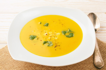 Carrot soup with feta cheese and coriander.