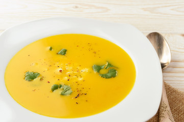 Carrot soup with feta cheese and coriander.