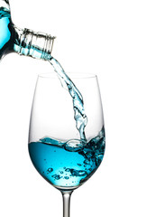 Blue wine was poured, spread isolated white background.