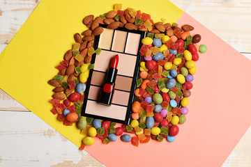 Children`s cosmetic on colorful wooden background