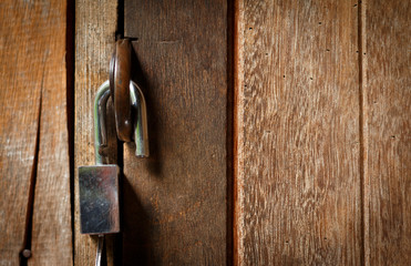 Unlock key on wooden door.Open lock concept.