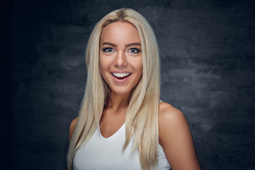 Fototapeta premium A girl in white t shirt on grey background.