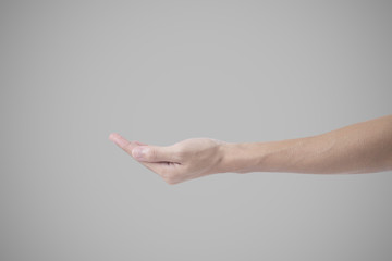 close-up man hand, arm sign isolated on gray background