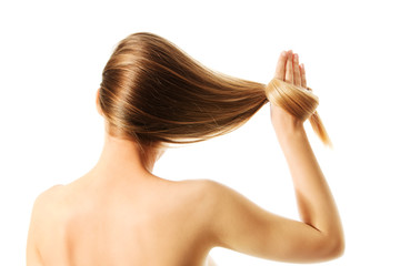 Fototapeta premium Long blond human hair close-up.