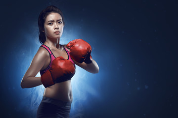 Asian female boxer athlete ready for fight