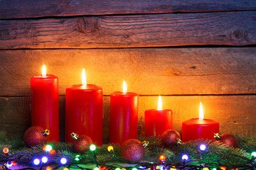 Red candles with Christmas ornament balls