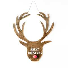Obraz premium words merry christmas and toy head of christmas deer on white background. flat lay, top view
