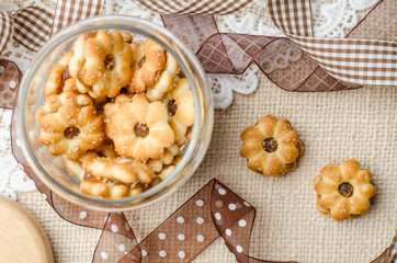 Coconut biscuit with pineapple jam on burlap sack background. De