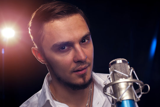 Portrait of male singer with microphone