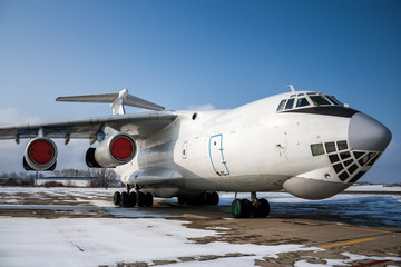 Close-up view of wide body cargo airplane in a cold winter airport