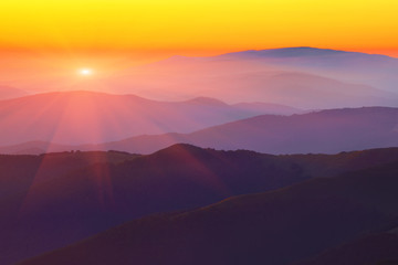 Silhouettes of the mountain hills at sunset