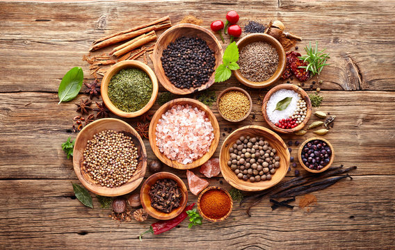 Spices and herbs on a wooden background
