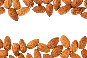 Nuts border of almonds on white background. Pile of selected almond close-up. Isolated.  For vegetarians.