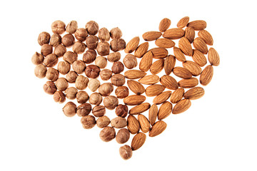 Hazelnut and almonds heap in heart shape on white background. Isolated. Valentine's Day.