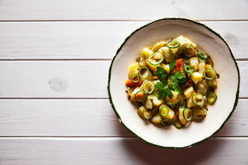 Tasty food. Vegetable stew on a wooden background. Country style