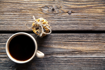 cookies with chocolate and coffee on a wooden background. drink, sweets, breakfast